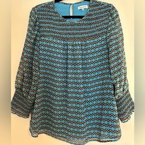 Women’s Calvin Klein blouse. Geometric design. Size L.